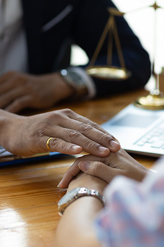 Lawyer consoling client after emotional distress caused a personal injury.